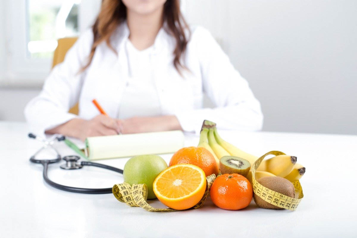 Nutritionist with fruits and vegetables