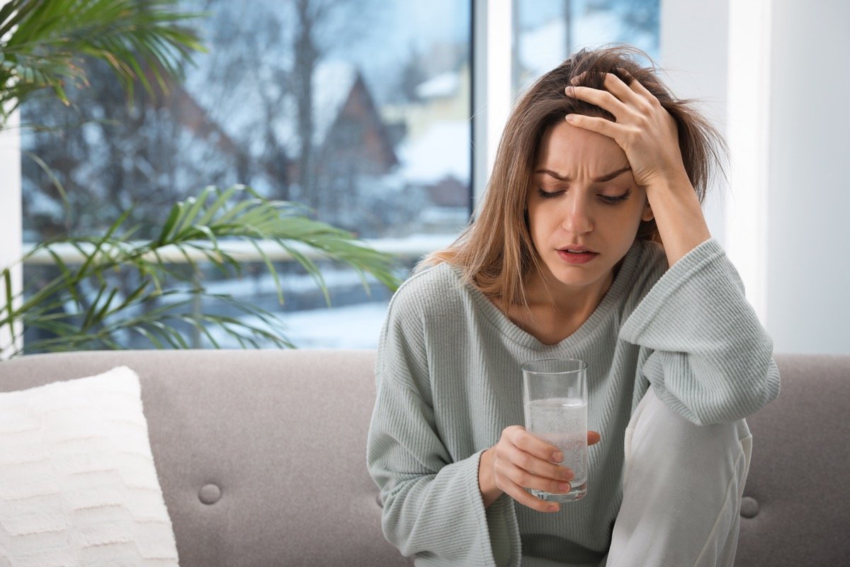 a woman with a hanging drinking water