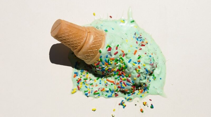 A melted ice cream cone with sprinkles